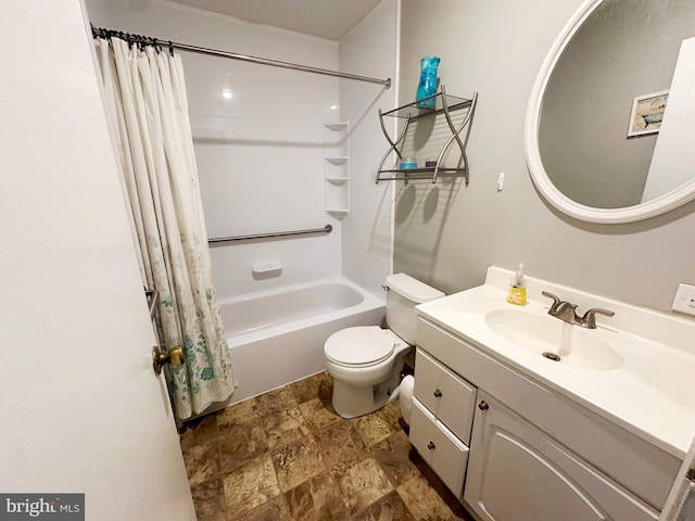 bathroom with toilet, stone finish floor, shower / bath combo with shower curtain, and vanity