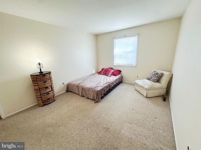 bedroom with carpet and baseboards