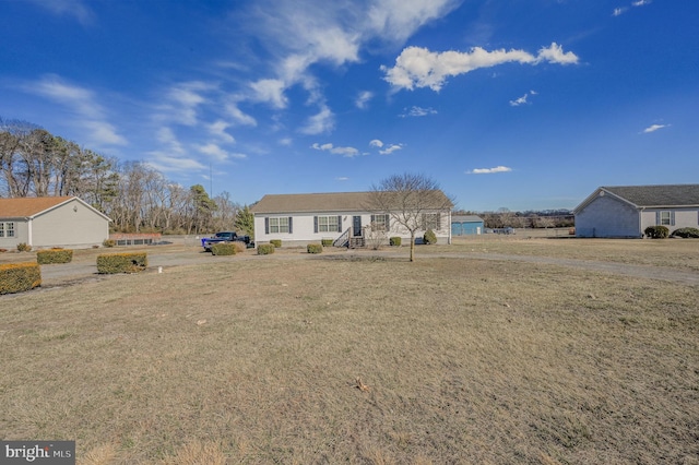 ranch-style house with a front yard