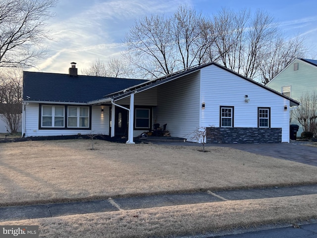 view of front of home featuring a chimney