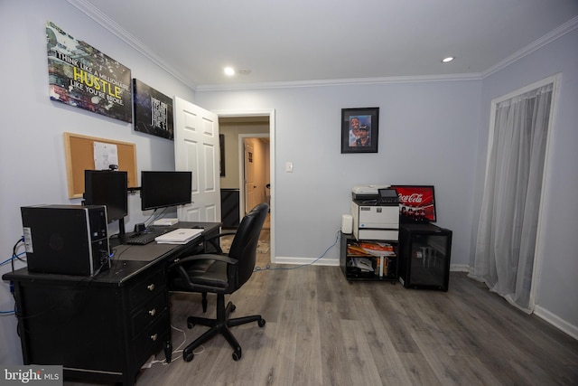 office with ornamental molding, recessed lighting, wood finished floors, and baseboards