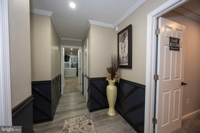 hall with recessed lighting, light wood-type flooring, and crown molding