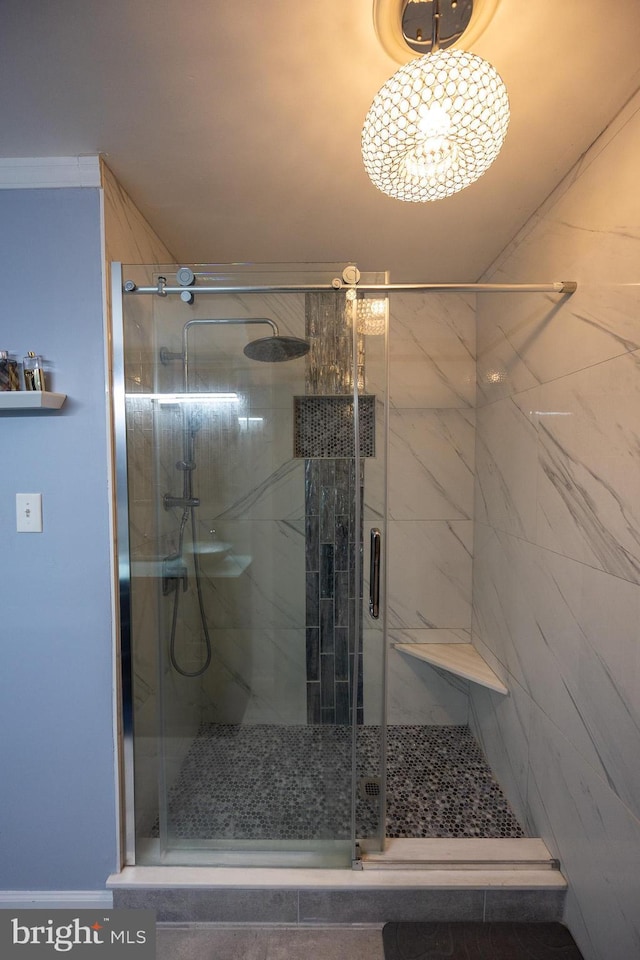 bathroom with a shower stall