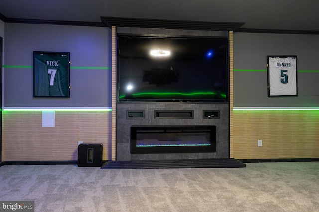 unfurnished living room with a fireplace, ornamental molding, and carpet flooring