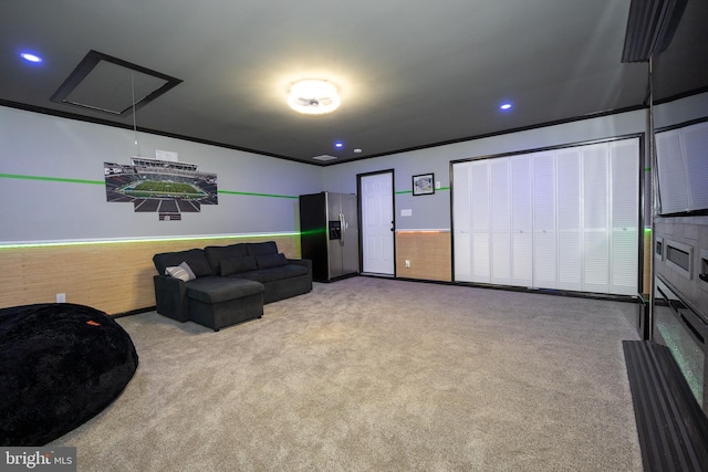 living area featuring attic access, carpet, crown molding, and recessed lighting