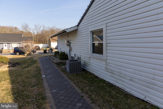 view of side of home featuring central air condition unit