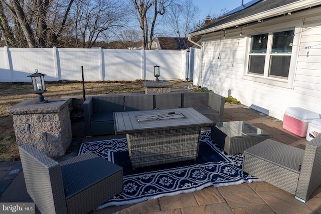 view of patio featuring outdoor lounge area and fence