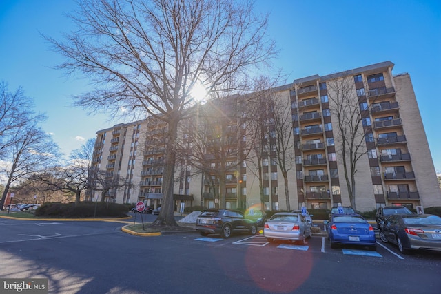 view of property featuring uncovered parking