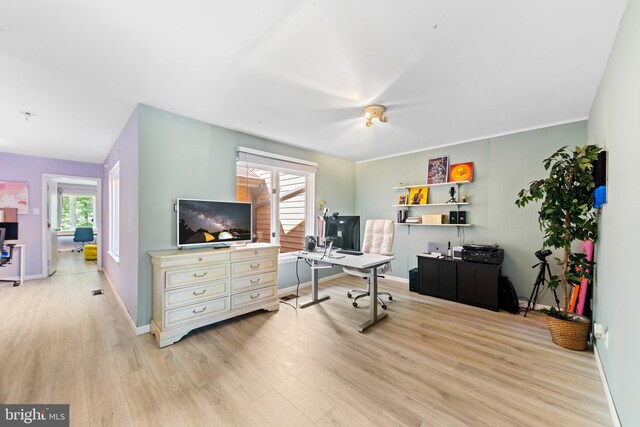 home office with baseboards and light wood finished floors