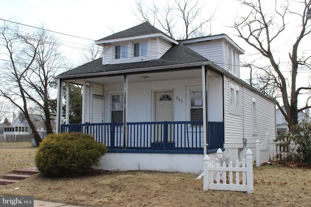 bungalow-style home featuring a shingled roof and a porch