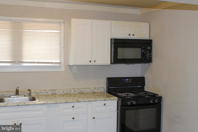 kitchen with black appliances, a sink, white cabinetry, and crown molding