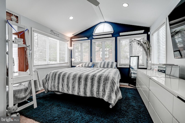 bedroom featuring lofted ceiling, dark carpet, and recessed lighting