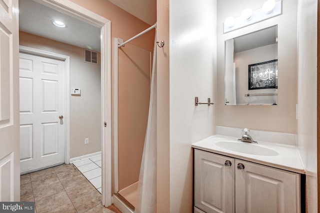 bathroom with curtained shower, visible vents, vanity, and tile patterned floors