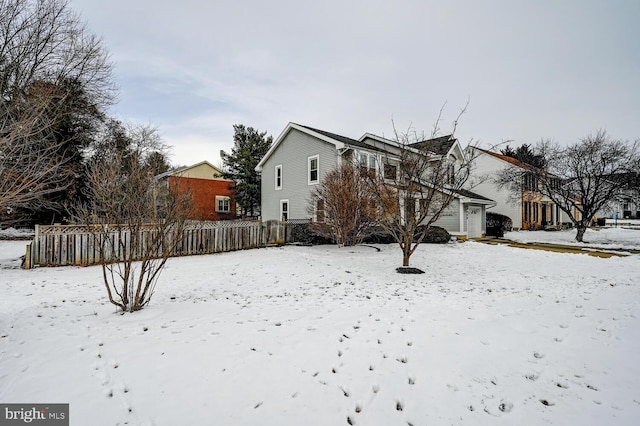 exterior space with a garage and fence