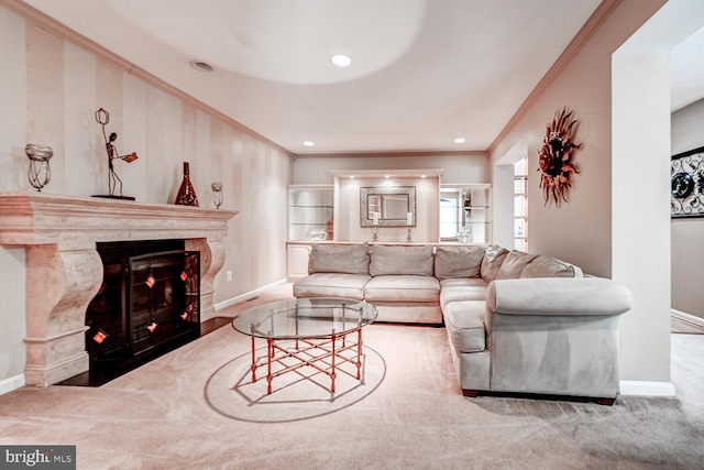 carpeted living area with crown molding, baseboards, and a premium fireplace