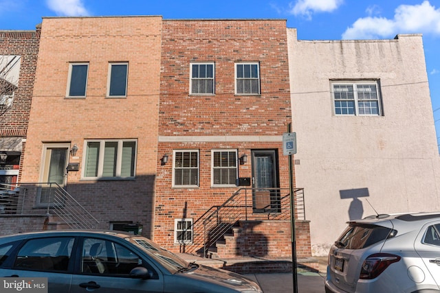 view of front facade featuring brick siding