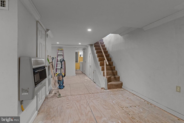 interior space featuring recessed lighting, visible vents, heating unit, and stairs