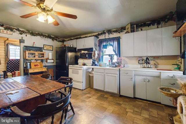 kitchen featuring ceiling fan, stone finish flooring, white cabinets, light countertops, and black appliances