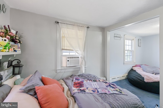 carpeted bedroom with a baseboard radiator and cooling unit