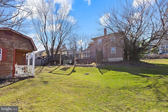 view of yard featuring stairs and a deck