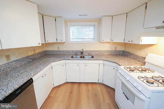 kitchen featuring white gas stove, under cabinet range hood, a sink, visible vents, and stainless steel dishwasher