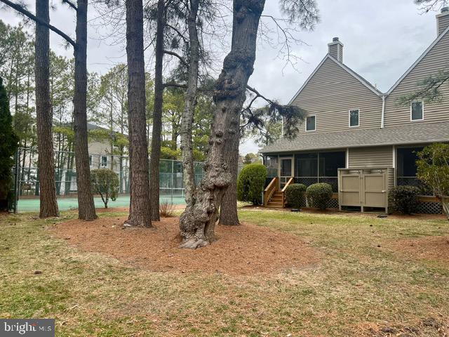 view of yard with a sunroom