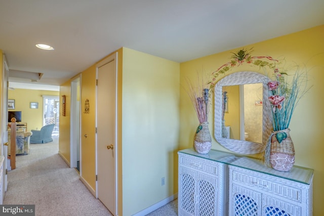 hall featuring recessed lighting, baseboards, and carpet floors