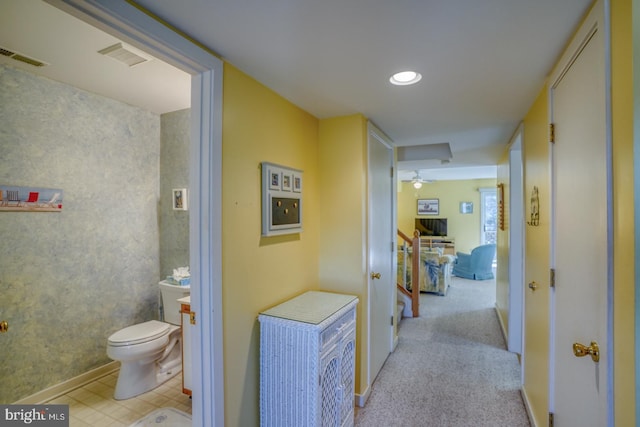 corridor featuring recessed lighting, visible vents, carpet floors, and baseboards