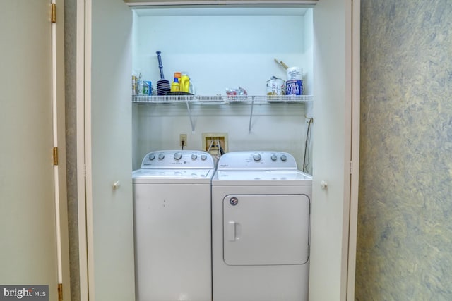 laundry area featuring washing machine and dryer and laundry area