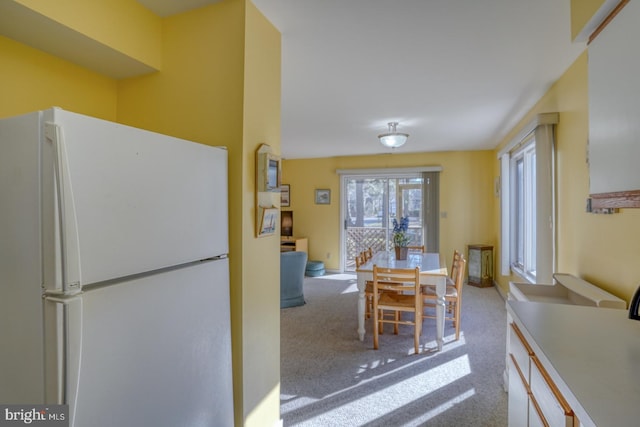 dining area featuring carpet flooring