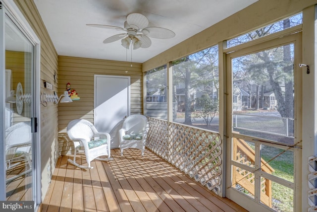 sunroom featuring a healthy amount of sunlight and ceiling fan