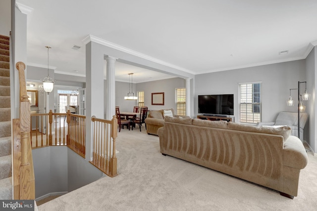 carpeted living room with stairway, crown molding, and visible vents