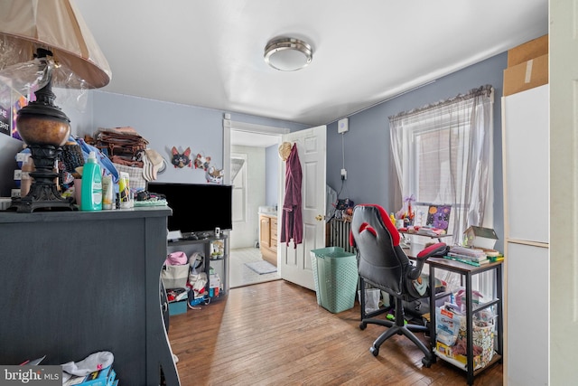 office space with wood-type flooring