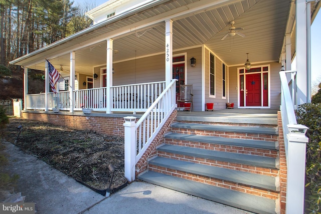 property entrance with covered porch and a ceiling fan