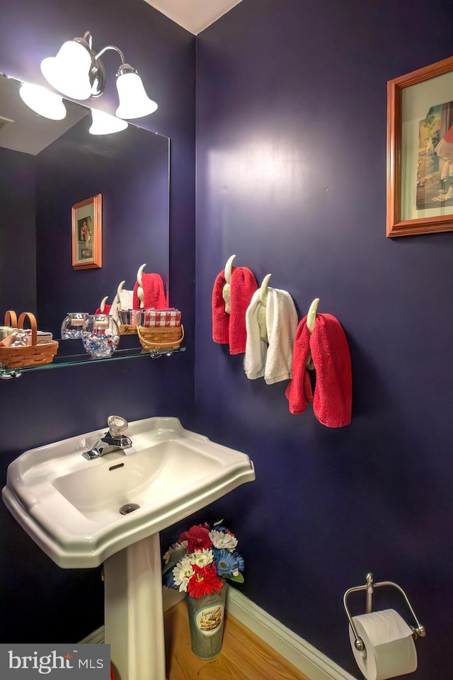 bathroom featuring visible vents, baseboards, and wood finished floors