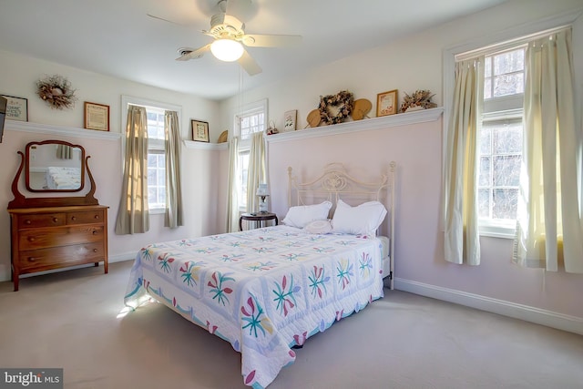 bedroom with carpet flooring, a ceiling fan, and baseboards