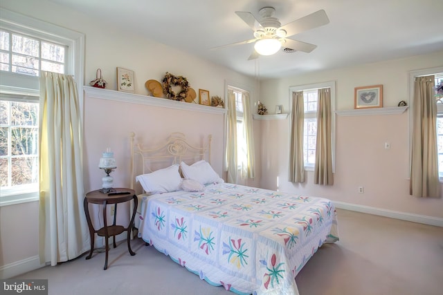 bedroom with carpet floors, a ceiling fan, and baseboards