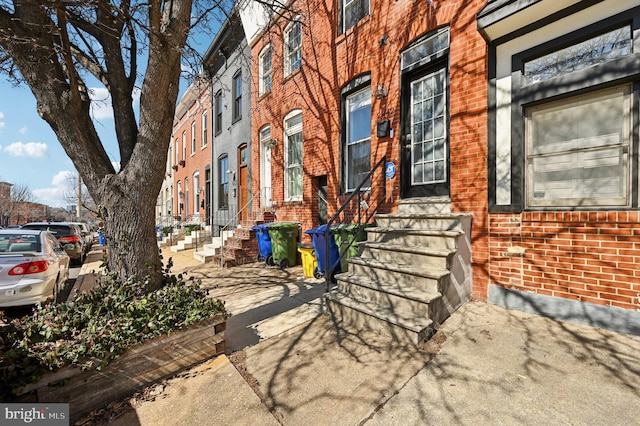 property entrance with brick siding