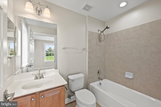 full bathroom featuring visible vents, vanity, toilet, and shower / bathtub combination