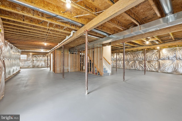 basement featuring stairs