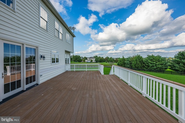 deck featuring a lawn