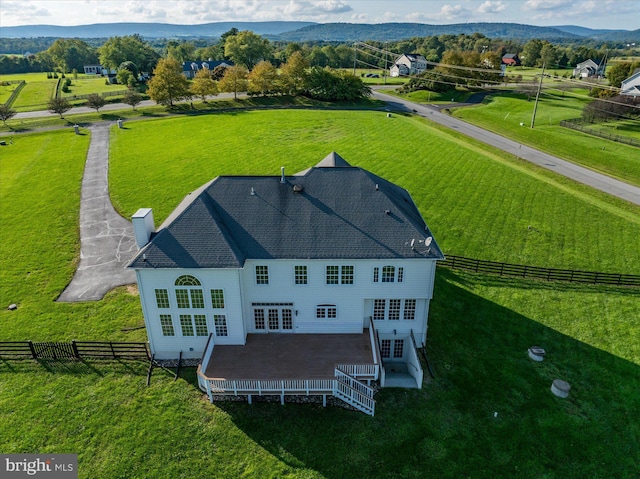 drone / aerial view featuring a rural view and a mountain view