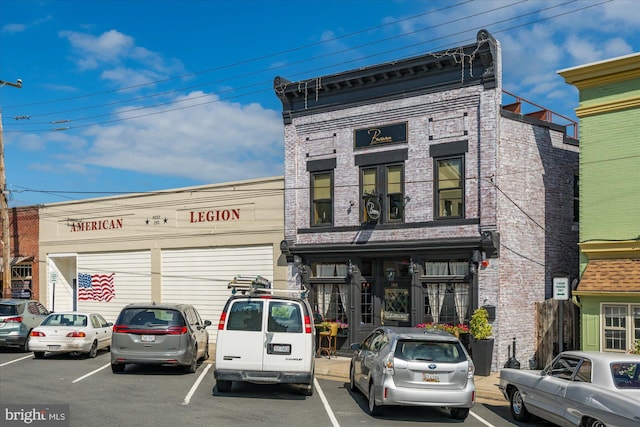 view of property featuring uncovered parking