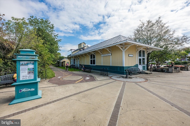 exterior space with metal roof