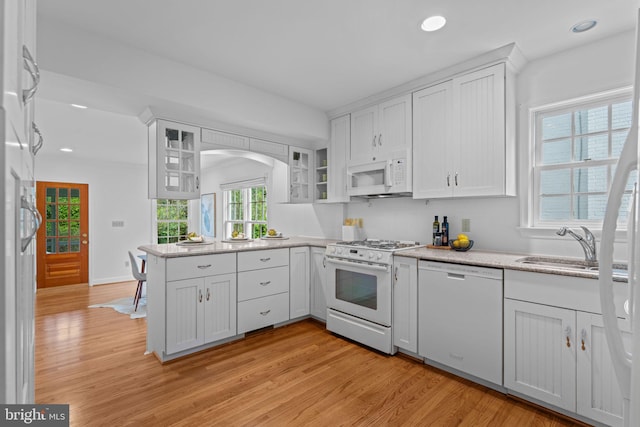 1733 Crestwood Dr, Alexandria, VA 22302 - kitchen with white appliances, white cabinets, and light wood finished floors