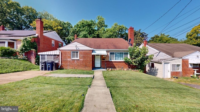 bungalow-style home featuring brick siding and a front lawn