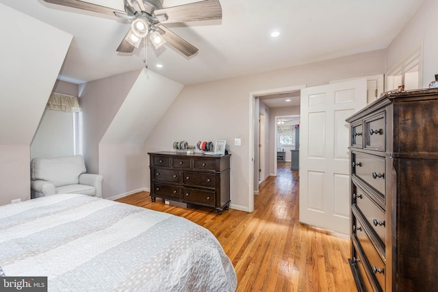 bedroom with recessed lighting, light wood-style flooring, a ceiling fan, vaulted ceiling, and baseboards