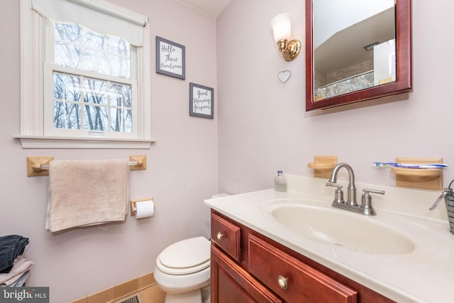 bathroom with vanity and toilet