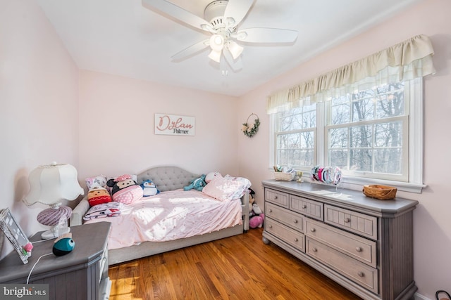 bedroom featuring ceiling fan and wood finished floors