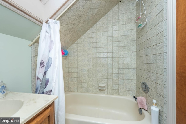 bathroom featuring shower / bath combination with curtain and vanity